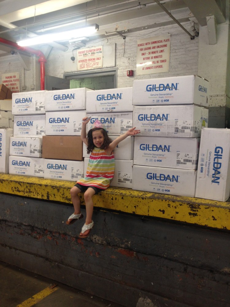 The kid delivers T-shirts